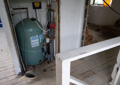 stripped out boiler cupboard in house during renovation.