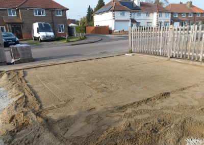 a newly laid driveway foundation showing levelled sand area