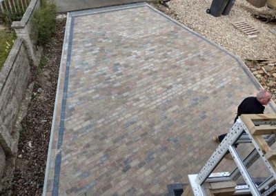 a new driveway laid with red and grey brick