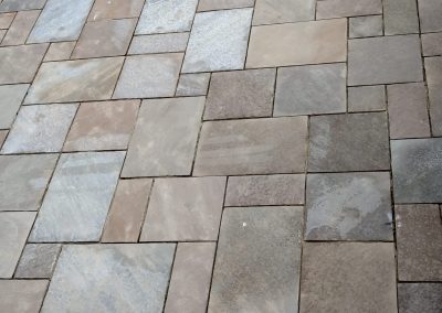 a newly laid square and rectangle section of patio